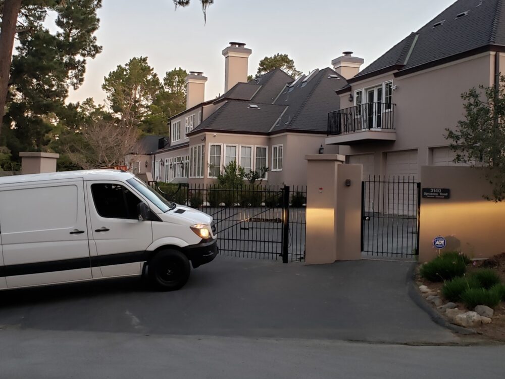 On-The-Spot Cleaning Services - A picture of the company Mercedes van driving into a gated mansion in California.