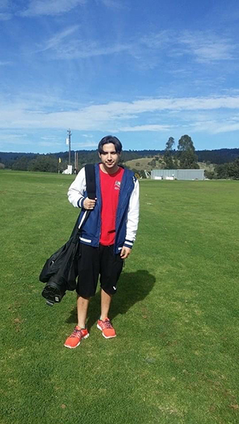 A picture of me at the golf course, with my golf bag around my shoulder.